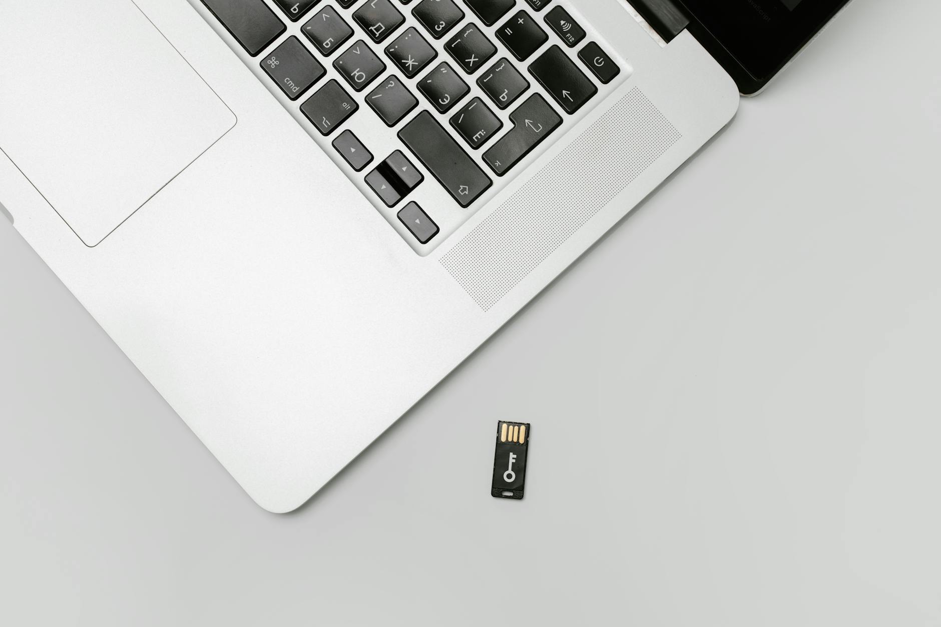 a memory card near a laptop