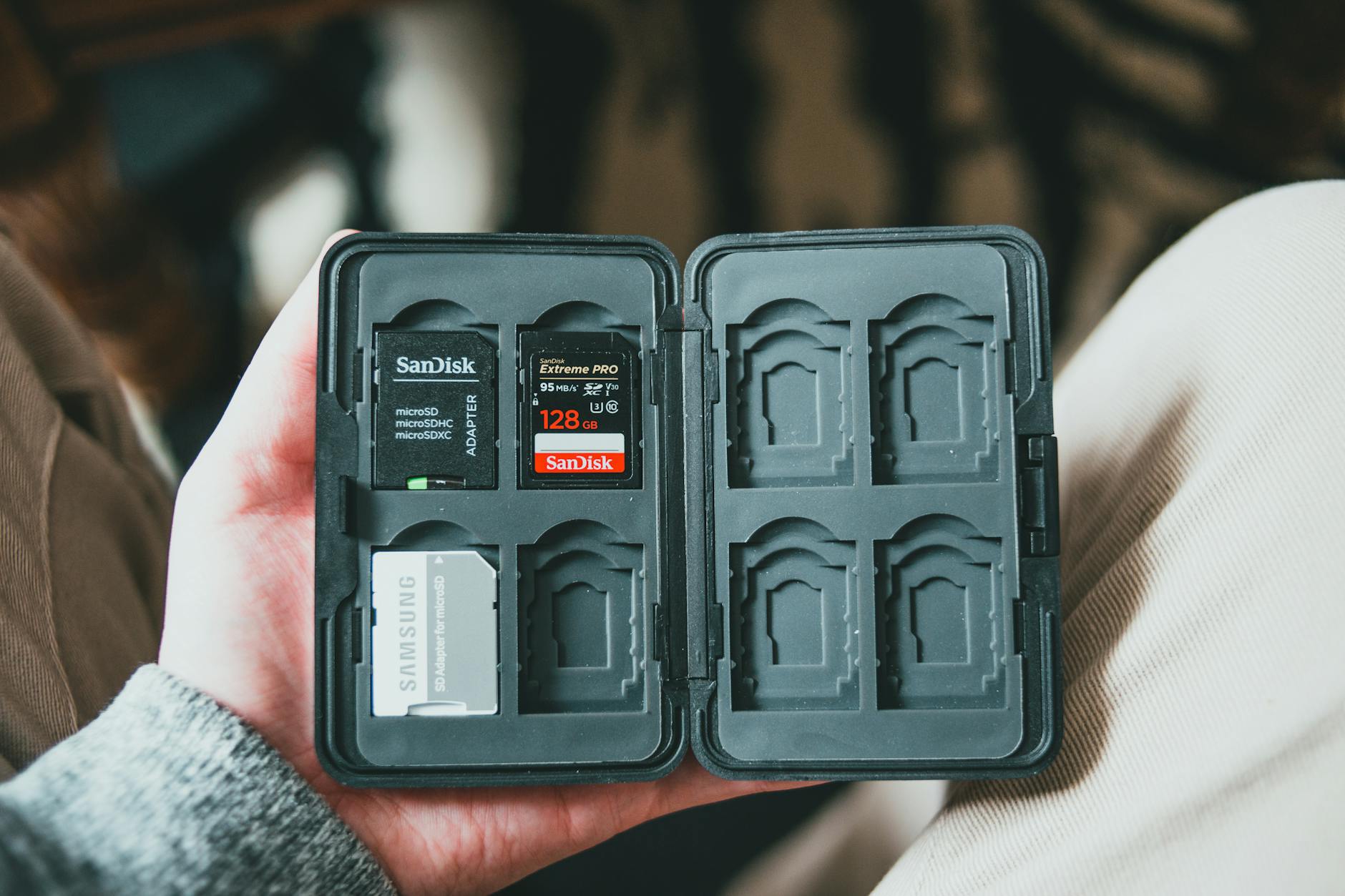 male holding case for memory cards